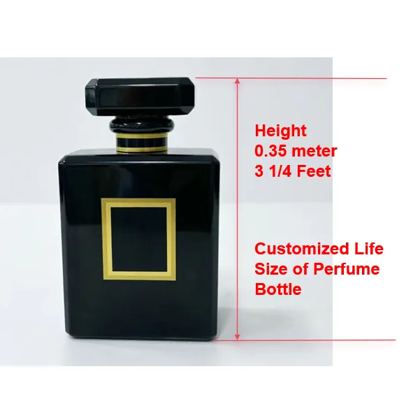 0.35 m black acrylic factice perfume bottle with a multi-faceted cap, two gold neck bands and a gold-bordered recessed label panel